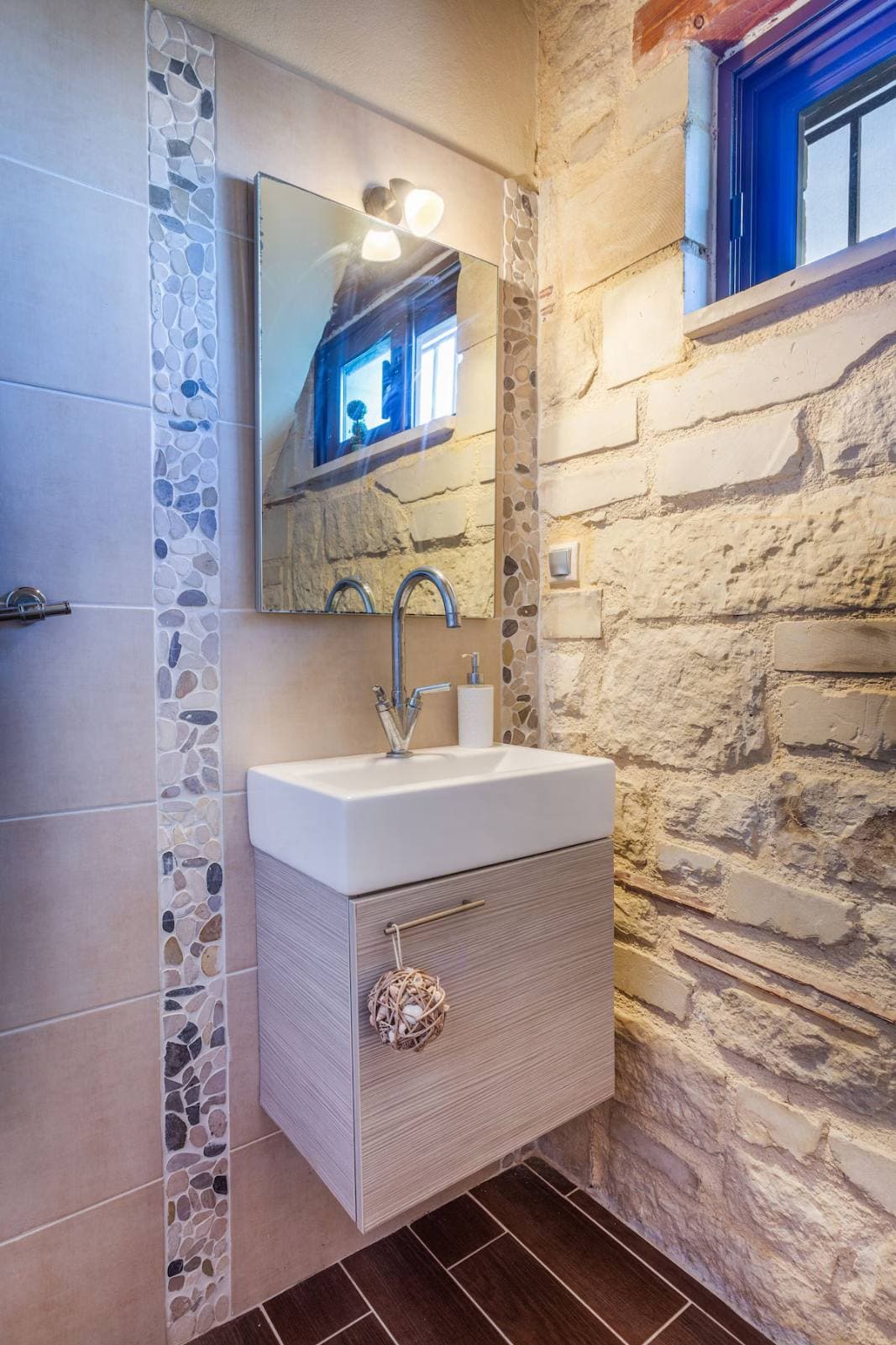 Stone-tiled master bathroom