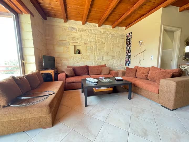 Cosy sitting area with stone fireplace